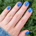 Blue Canoe on customer hand