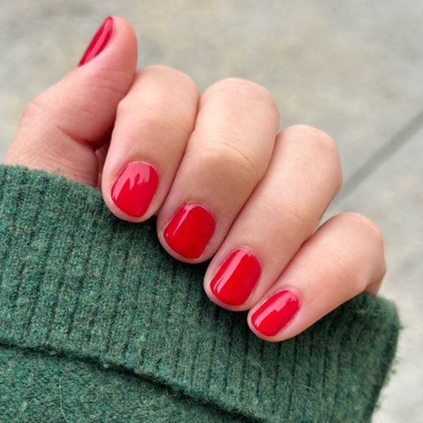 hand with bright red polish