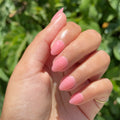Pink Pineapple Gloss on customer hand