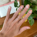 Starfruit Shimmer Gloss on customer hand